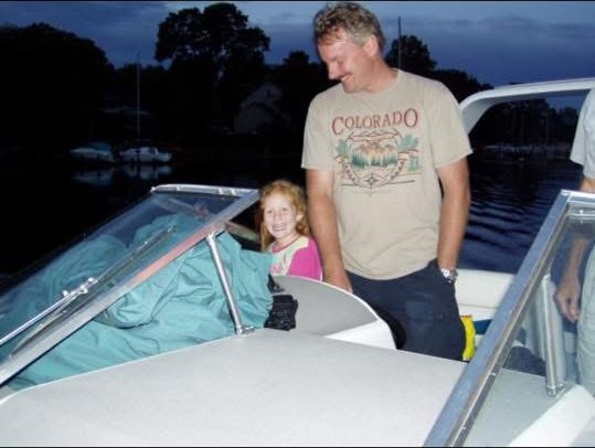 Audrey as a kid on the boat with her dad on the Chesapeake Bay